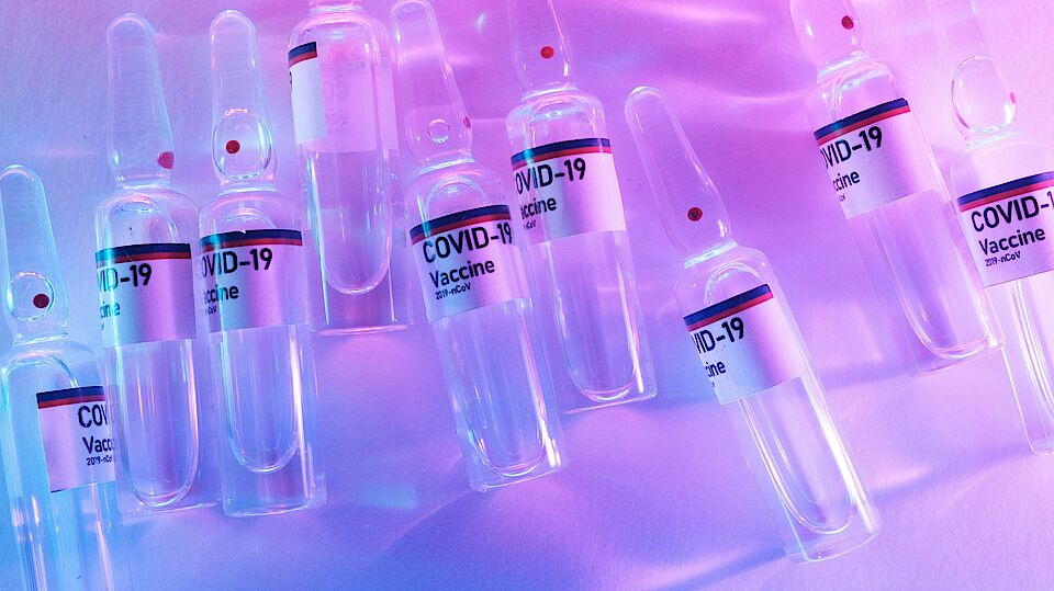 Photo by Alena Shekhovtcova: https://www.pexels.com/photo/heap-of-vials-of-coronavirus-vaccine-scattered-on-table-in-laboratory-6074966/